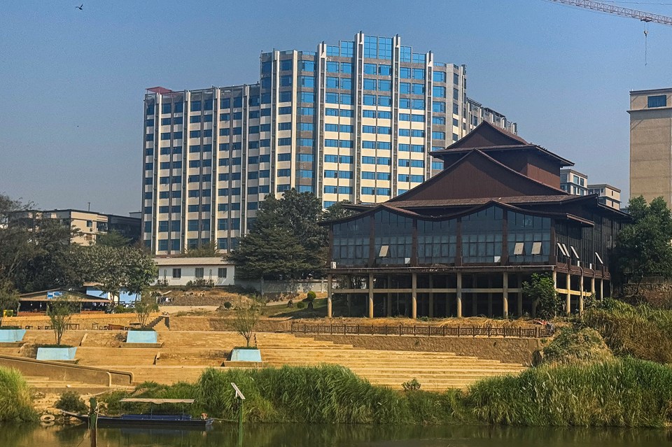 Buildings in Shwe Kokko, Myanmar, near a river.